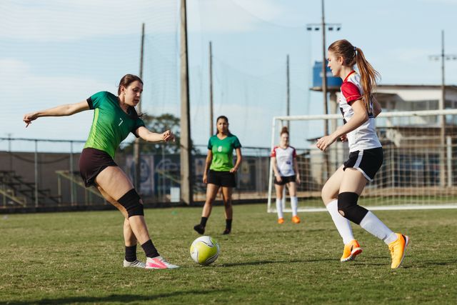 women playing football against each other